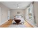 Bright bedroom featuring hardwood floors, a large window, and neutral walls, creating a serene and comfortable atmosphere at 14 S Lincoln St # 16, Denver, CO 80209