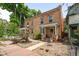 Classic brick home with a welcoming front porch, landscaped yard, and charming curb appeal in a desirable neighborhood at 14 S Lincoln St # 16, Denver, CO 80209