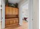 Hallway featuring a built in wood cabinet and view into a bedroom at 14 S Lincoln St # 16, Denver, CO 80209
