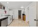 Spacious basement kitchen featuring updated appliances, white countertops, and brown cabinets at 14 S Lincoln St # 16, Denver, CO 80209