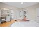 Comfortable main bedroom with an attached bathroom and a view to another room at 14 S Lincoln St # 16, Denver, CO 80209