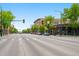 Street view with mature trees and multiple commercial buildings at 14 S Lincoln St # 16, Denver, CO 80209