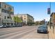 Street view featuring mature trees and multiple commercial buildings at 14 S Lincoln St # 16, Denver, CO 80209