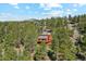 A rustic mountain home nestled in a lush forest, boasting incredible privacy and scenic views at 1278 Aspen Dr, Evergreen, CO 80439