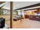 Finished basement with bedroom, bar, kitchen, and eating area at 1278 Aspen Dr, Evergreen, CO 80439
