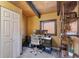 Home office with a desk, shelves, and a large window for natural light at 1278 Aspen Dr, Evergreen, CO 80439