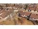 Aerial view of townhomes featuring brown roofs, decks, and well-maintained community landscaping at 1161 S Marshall St, Lakewood, CO 80232