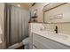 Bathroom features a new white vanity and a shower with a gray shower curtain at 1161 S Marshall St, Lakewood, CO 80232
