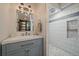 Modern bathroom with stylish vanity, walk-in shower with elegant tile work at 1161 S Marshall St, Lakewood, CO 80232