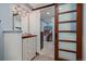Modern bathroom with double vanity and walk-in closet with sliding barn door at 1161 S Marshall St, Lakewood, CO 80232