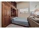 Bedroom with a large built-in Murphy bed, closet, and shelving unit at 1161 S Marshall St, Lakewood, CO 80232
