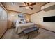 Comfortable bedroom features plush carpeting, a ceiling fan, and ample natural light at 1161 S Marshall St, Lakewood, CO 80232