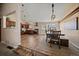 Open-concept dining area with wood floors and modern lighting at 1161 S Marshall St, Lakewood, CO 80232