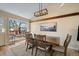 Bright dining room with large window, natural light, and hardwood table at 1161 S Marshall St, Lakewood, CO 80232