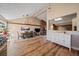 The dining room has a fireplace and an open floorplan with lots of natural light at 1161 S Marshall St, Lakewood, CO 80232