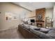 Comfortable living room featuring a stone fireplace and open layout at 1161 S Marshall St, Lakewood, CO 80232