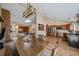 Open concept living space with hardwood floors and modern lighting at 1161 S Marshall St, Lakewood, CO 80232