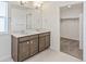 Bathroom features a double sink vanity and a walk-in closet at 14269 Beebalm Ave, Parker, CO 80134