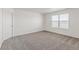 Spacious bedroom with neutral carpet and a window providing natural light at 14269 Beebalm Ave, Parker, CO 80134