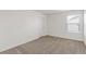 Bedroom features neutral walls and trim, and a window for natural light at 14269 Beebalm Ave, Parker, CO 80134