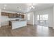Bright open kitchen with island, pendant lighting, wood cabinets and stainless steel appliances at 14269 Beebalm Ave, Parker, CO 80134