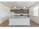 Open kitchen with granite countertops, stainless steel appliances, and wood flooring at 14269 Beebalm Ave, Parker, CO 80134