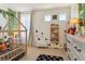 Whimsical bedroom with a wood bed frame, decorative stars, and built-in shelving for books at 4736 S Buchanan St, Aurora, CO 80016
