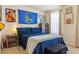 Comfortable bedroom with a Golden State Warriors theme and rustic wood furniture at 4736 S Buchanan St, Aurora, CO 80016