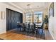 Bright dining room featuring a modern chandelier and large windows at 4736 S Buchanan St, Aurora, CO 80016