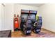 Fun game room featuring two racing games, a punching bag, and wood-look floors at 4736 S Buchanan St, Aurora, CO 80016