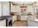 Well-equipped kitchen with stainless steel appliances, granite countertops, ample cabinet space, and a cozy breakfast bar at 4736 S Buchanan St, Aurora, CO 80016