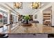 Open-concept space featuring a granite island, modern lighting, seamless flow into the living room, and stylish decor at 4736 S Buchanan St, Aurora, CO 80016