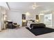 Large main bedroom features a comfortable sitting area and tray ceiling at 4736 S Buchanan St, Aurora, CO 80016