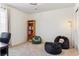 Cozy room with beanbag chairs, a bookshelf, and natural light at 4736 S Buchanan St, Aurora, CO 80016