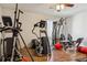 Bright home gym with various exercise machines and a window for natural light at 4736 S Buchanan St, Aurora, CO 80016