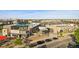 Aerial view showcases a shopping center with diverse stores, outdoor seating, and ample parking at 10065 Martin Luther King Blvd, Denver, CO 80238