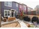 Backyard patio with outdoor seating, landscaping and partial fencing at 10065 Martin Luther King Blvd, Denver, CO 80238