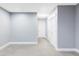 Spacious bedroom with neutral carpet, a large closet and light blue paint at 10065 Martin Luther King Blvd, Denver, CO 80238