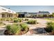 Outdoor plaza with greenery leads to modern stores, creating a vibrant and welcoming community atmosphere at 10065 Martin Luther King Blvd, Denver, CO 80238