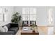 Bright living room with hardwood floors, modern furniture, and ample natural light at 10065 Martin Luther King Blvd, Denver, CO 80238