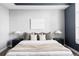 Cozy main bedroom with a large window, accent wall, and comfortable furnishings at 10065 Martin Luther King Blvd, Denver, CO 80238