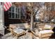 Comfortable outdoor patio with brick features a sectional sofa and modern accent seating at 10065 Martin Luther King Blvd, Denver, CO 80238