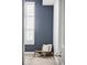 Cozy sitting area featuring a stylish chair and a large window with shutters at 10065 Martin Luther King Blvd, Denver, CO 80238