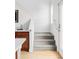 Bright staircase with neutral carpet leads to the upper level of the home at 10065 Martin Luther King Blvd, Denver, CO 80238