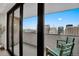 Relaxing balcony space with seating and stunning city skyline views at 1020 15Th St # 31E, Denver, CO 80202
