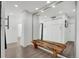 Contemporary design with a wooden bench and storage, enhanced by a large mirror at 1020 15Th St # 31E, Denver, CO 80202