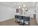Modern kitchen with marble countertop island and pendant lighting at 1020 15Th St # 31E, Denver, CO 80202
