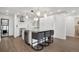 Modern kitchen with a large island, seating, and stylish lighting at 1020 15Th St # 31E, Denver, CO 80202