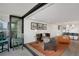 Open floor plan with living area, balcony access, and modern kitchen at 1020 15Th St # 31E, Denver, CO 80202