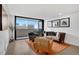 Chic living room with balcony, city views, and stylish, comfortable seating at 1020 15Th St # 31E, Denver, CO 80202
